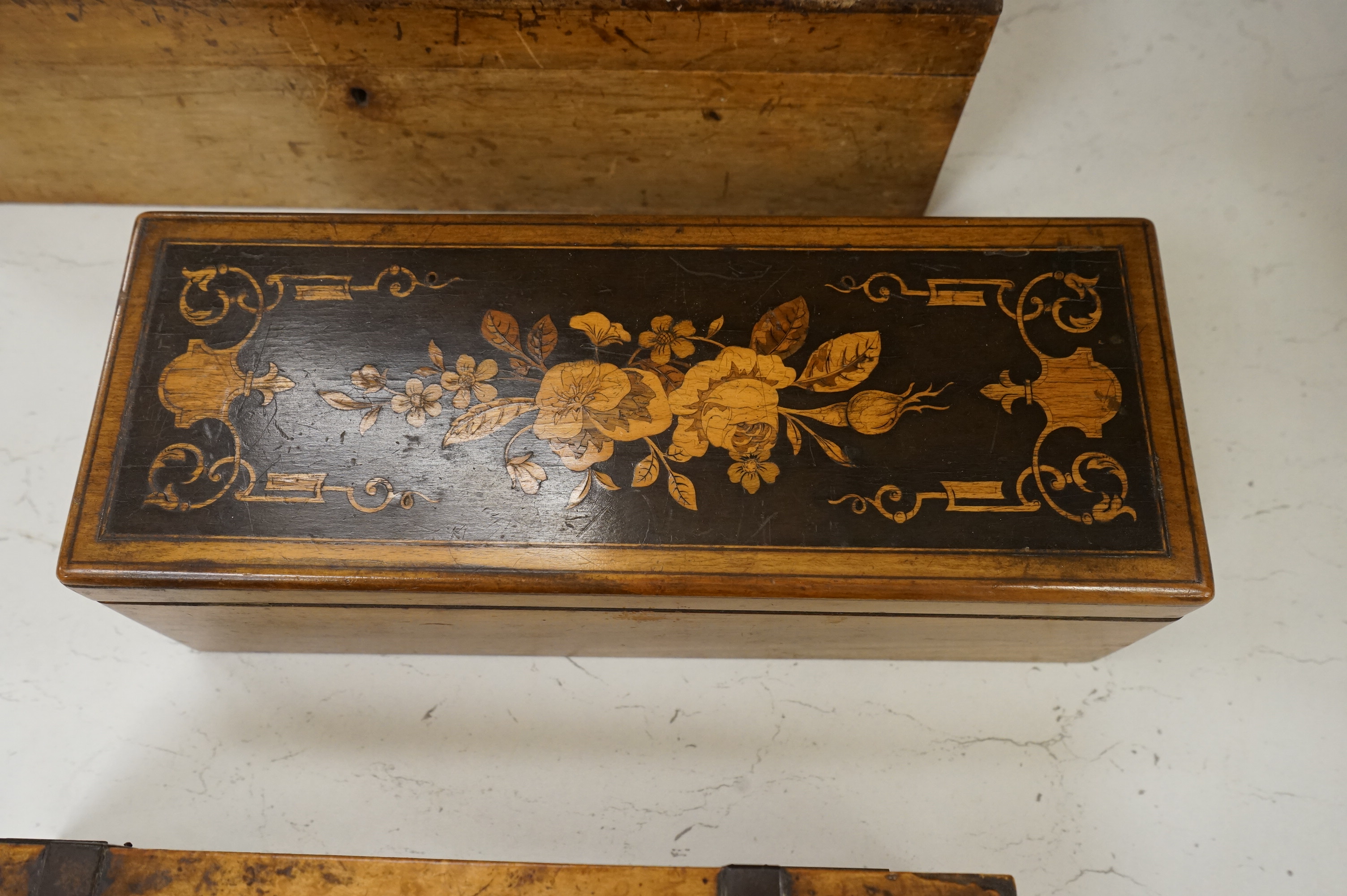 Three boxes comprising a Sorrento ware glove box, a marquetry inlaid slope and a rosewood dressing box, largest 39cm wide